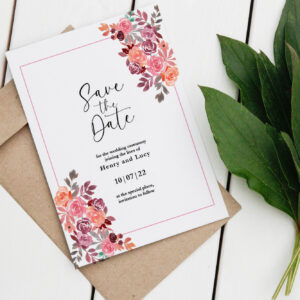 Save the Date card with script and pink flowers
